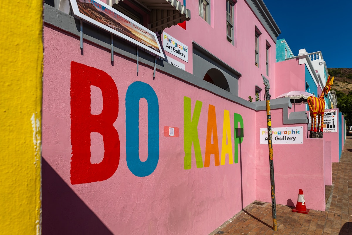 Colourful Bo-Kaap sign on a pink wall in Cape Town's Cape Malay quarter, South Africa