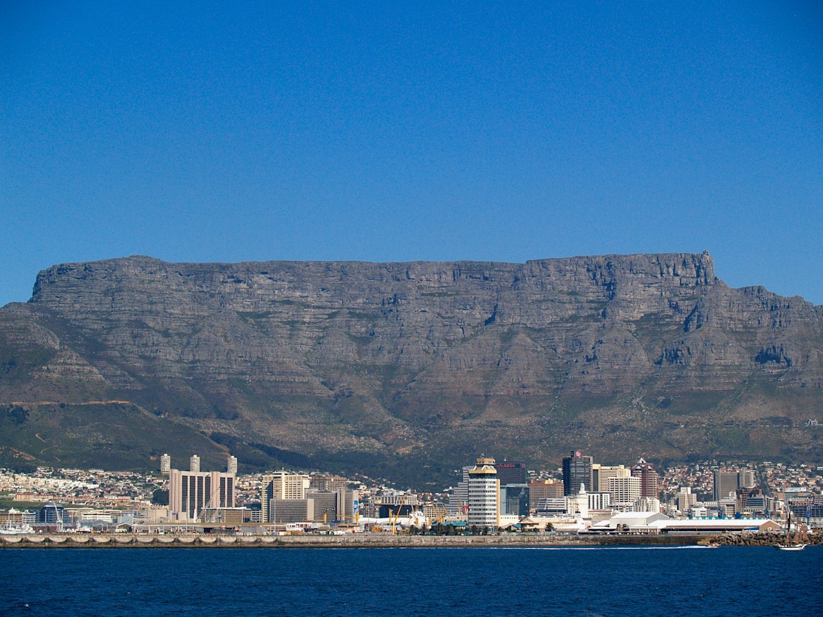 The Cape Town waterfront at sunset with Table Mountain in the background and the harbour in the foreground