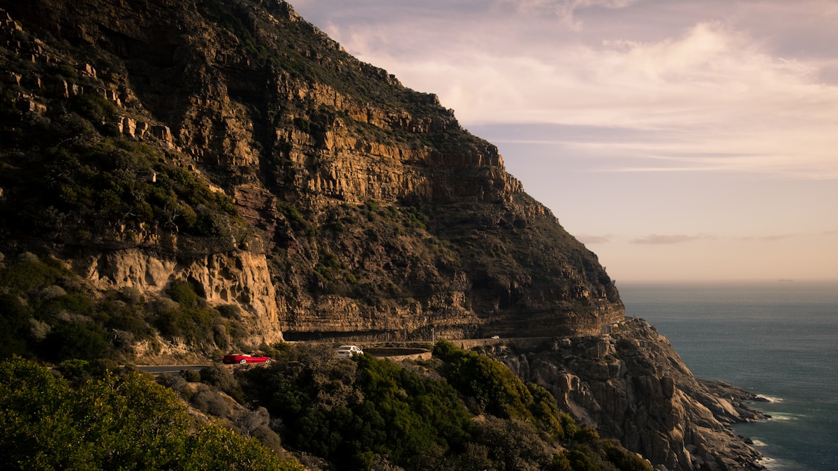 Car driving along Chapman's Peak coastal road, Cape Peninsula, South Africa