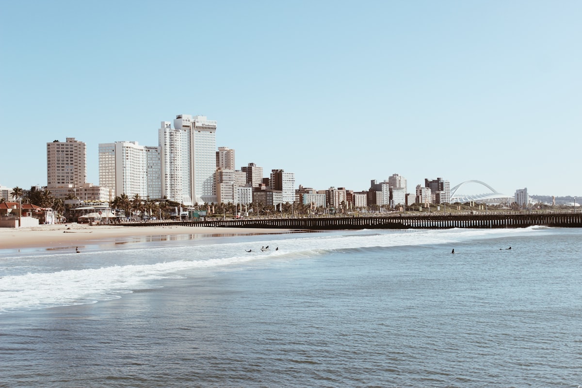 Durban beachfront skyline viewed from the ocean with Moses Mabhida Stadium in the background