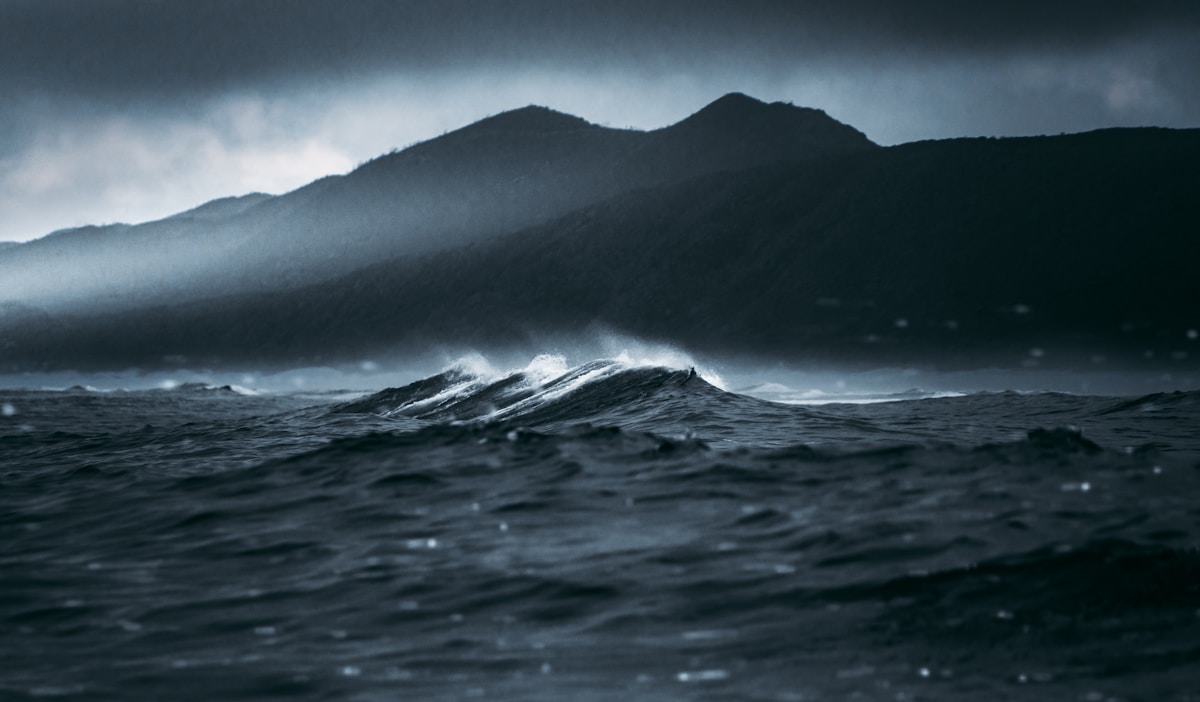 Stormy waves and coastal cliffs at the Knysna Heads, Garden Route, South Africa
