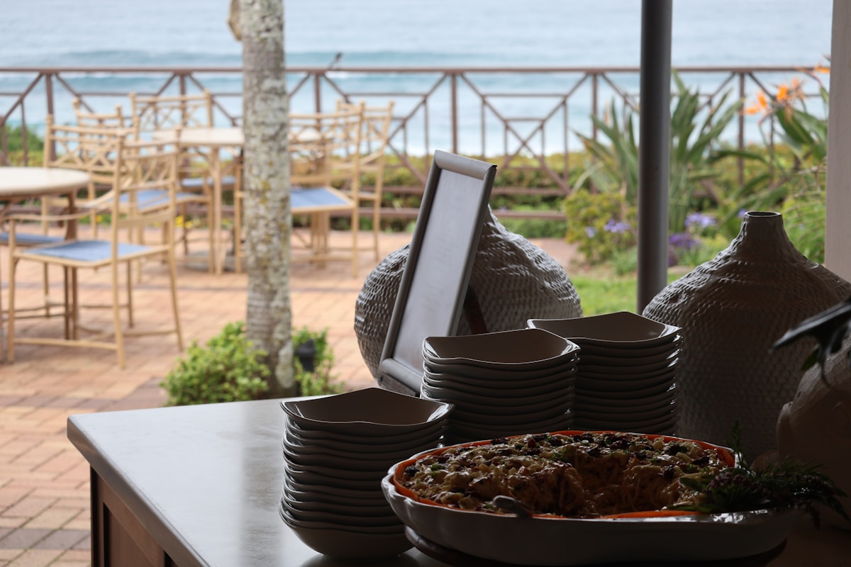 Open-air beachfront restaurant with tables set overlooking the Indian Ocean, KwaZulu-Natal, South Africa