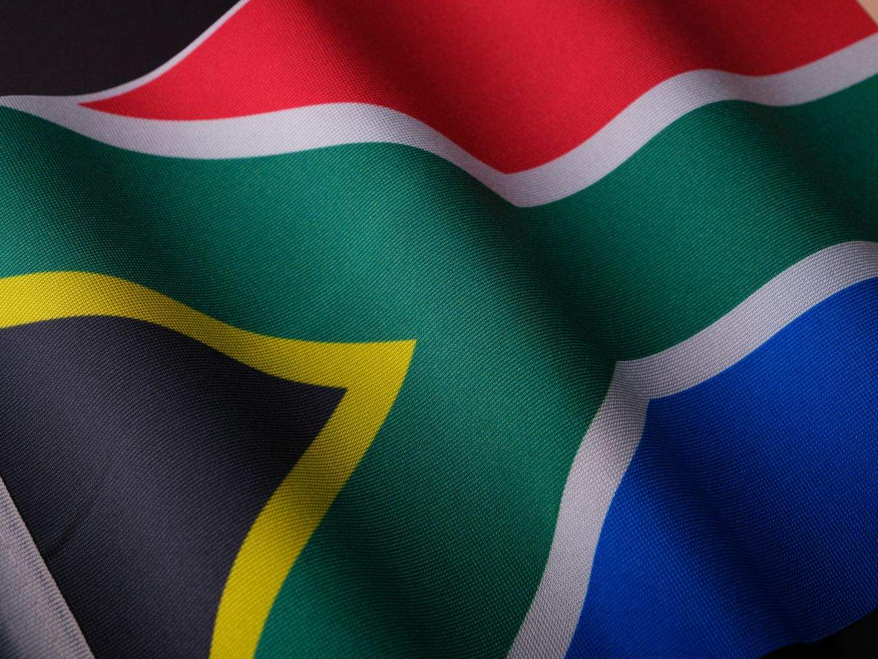 The national flag of South Africa waving - public holidays guide
