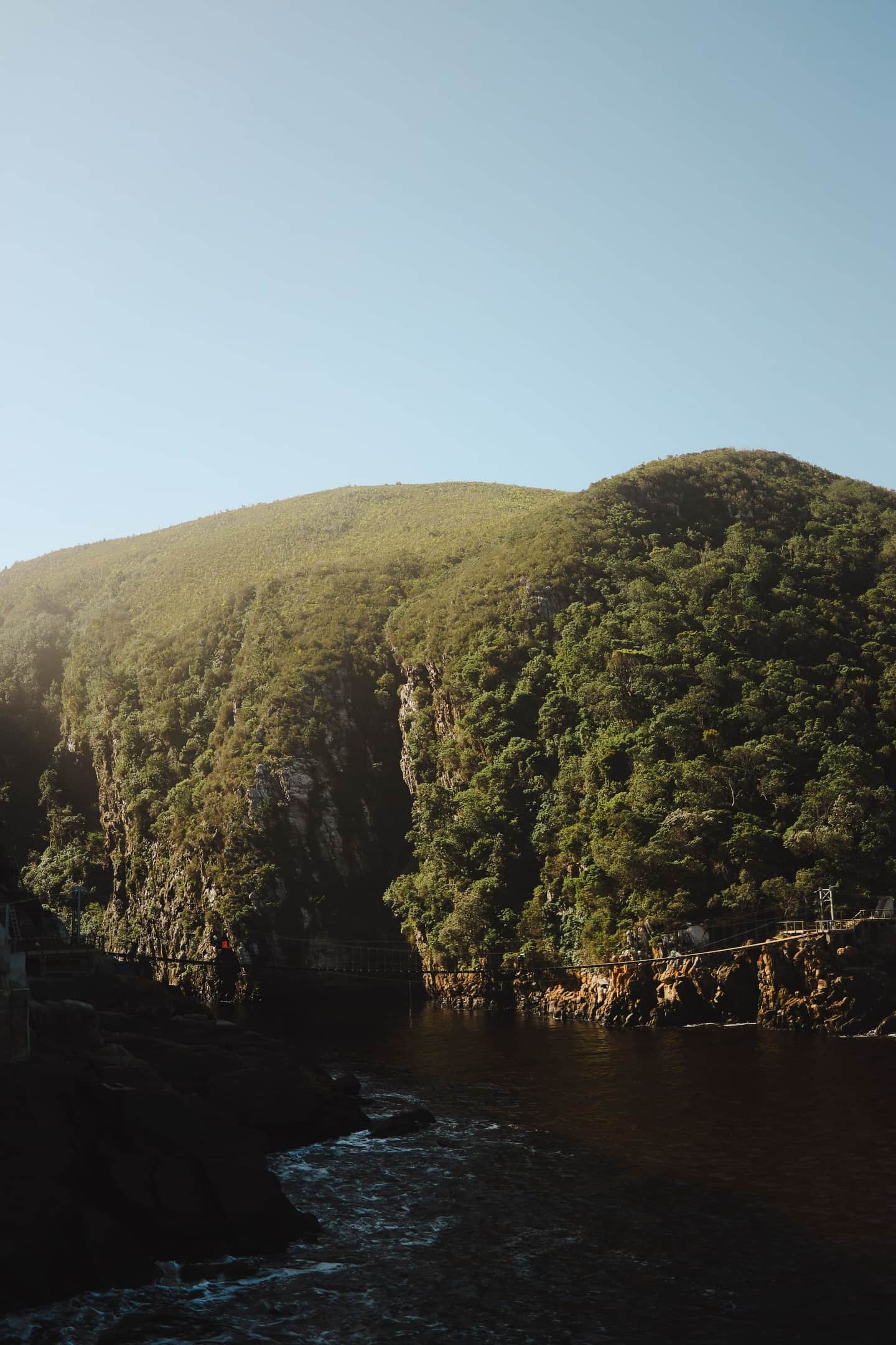 Suspension bridge over rocky gorge at Storms River in Tsitsikamma National Park, South Africa